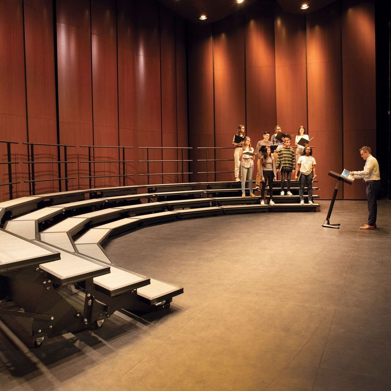 Wenger choral risers with singers rehearsing