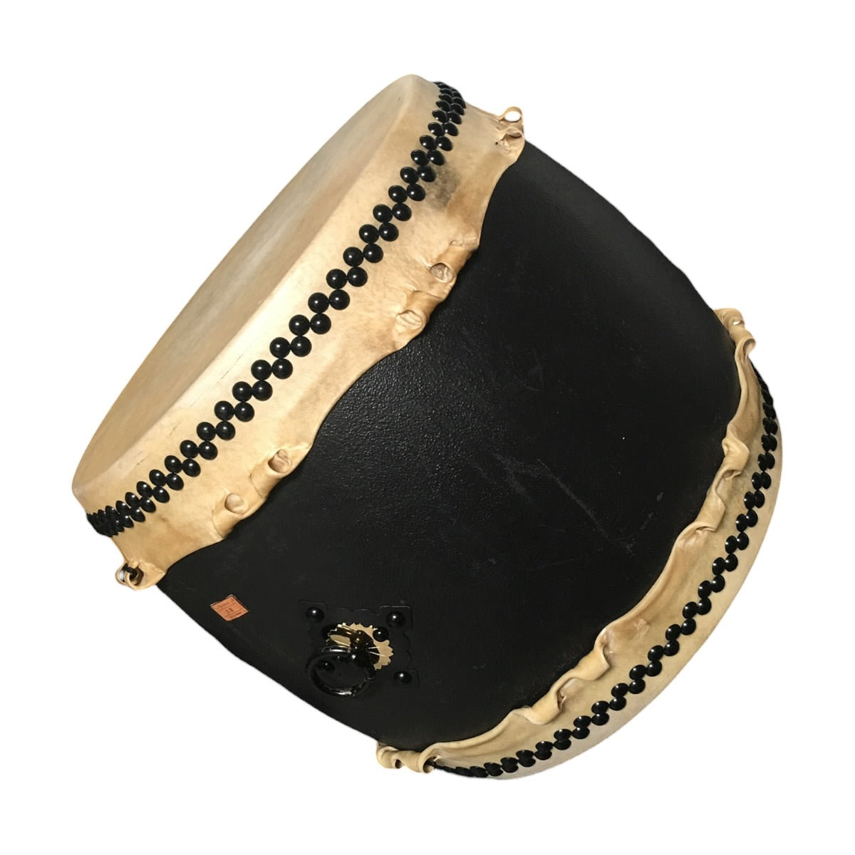 24-inch taiko drum with black lacquered shell, rawhide heads and black tack rows, shown off its stand