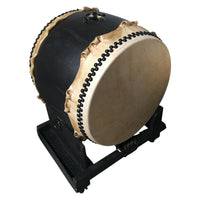 24-inch taiko drum mounted on a black wooden stand, angled playing position