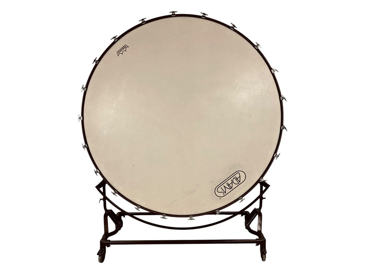Adams 70-inch concert bass drum with a Remo head, mounted in a suspension cradle on casters