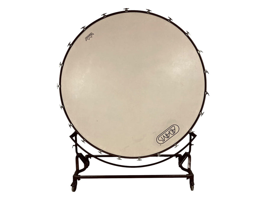 Adams 70-inch concert bass drum with a Remo head, mounted in a suspension cradle on casters