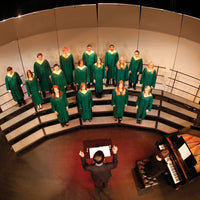 Choir performing on Wenger choral risers in front of an acoustical shell