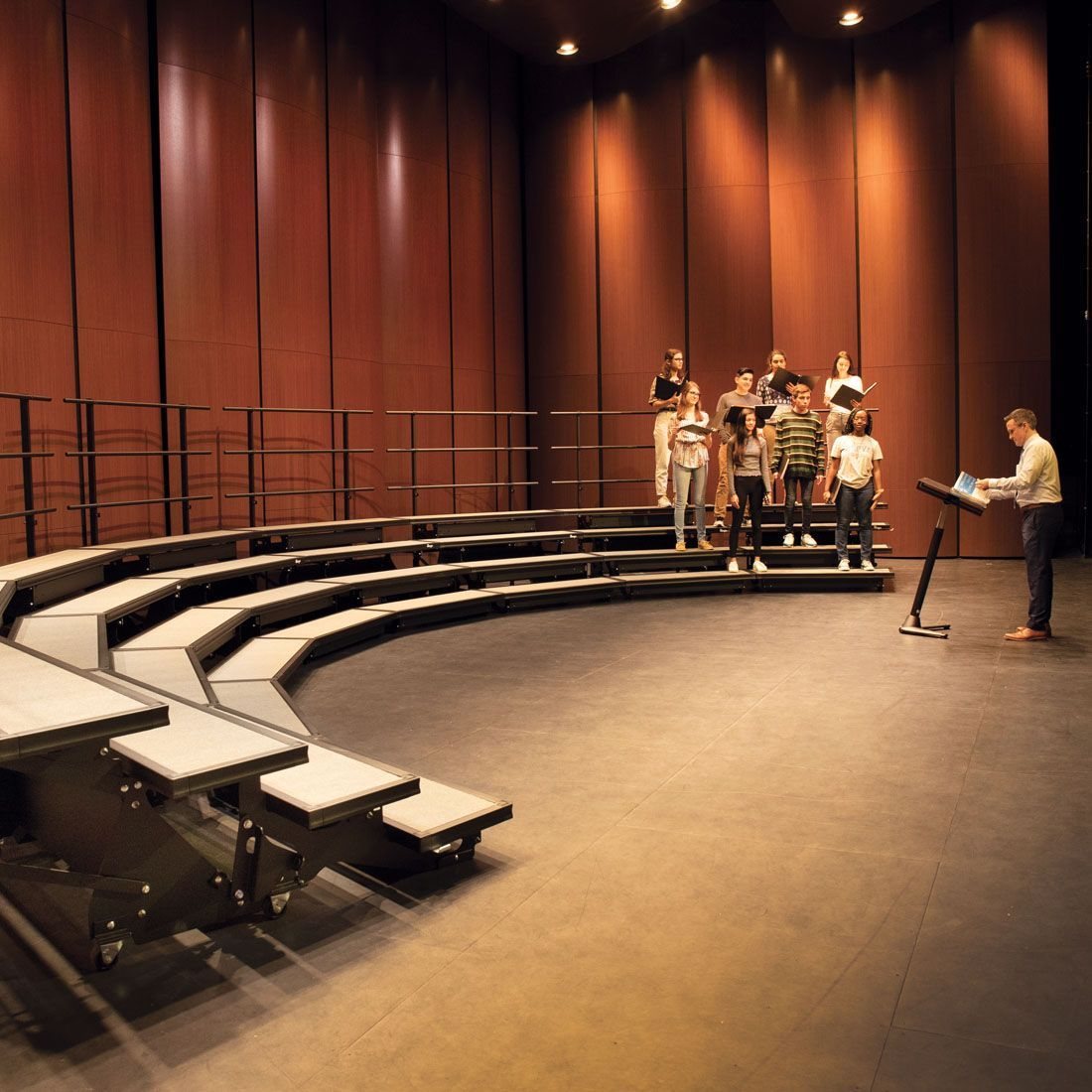 Wenger choral risers with singers rehearsing