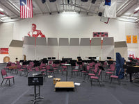 Cal Perc LA acoustical shells set behind an orchestra in a gymnasium