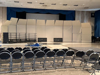 Cal Perc LA acoustical sound shells set up on a school auditorium stage