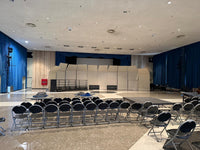 Wide view of Cal Perc LA sound shells and choral risers installed in a hall
